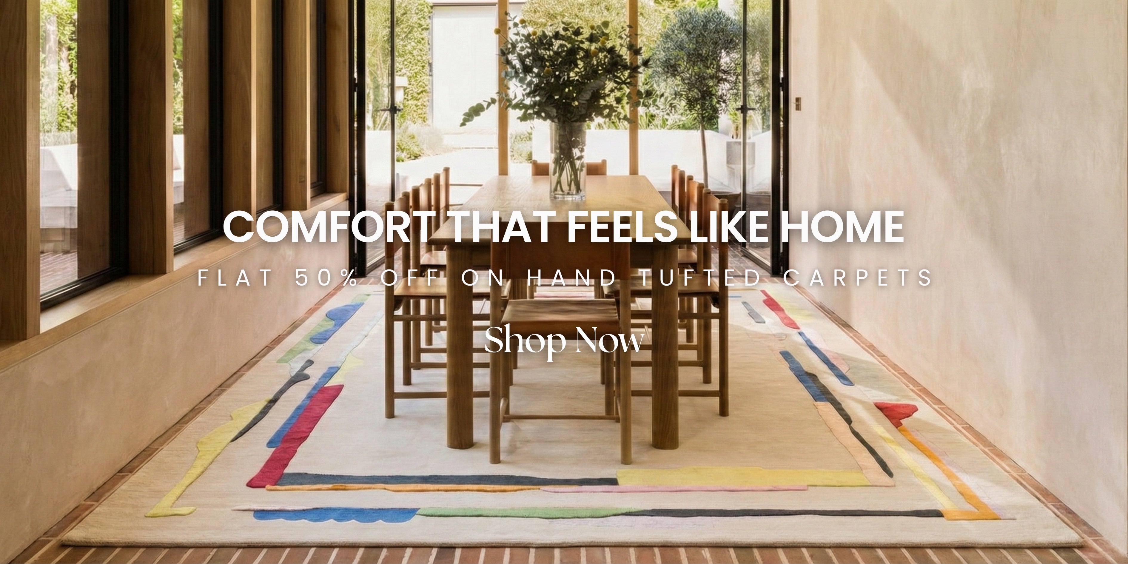 Colorful hand-tufted carpet in a modern living room with dining table and chairs.