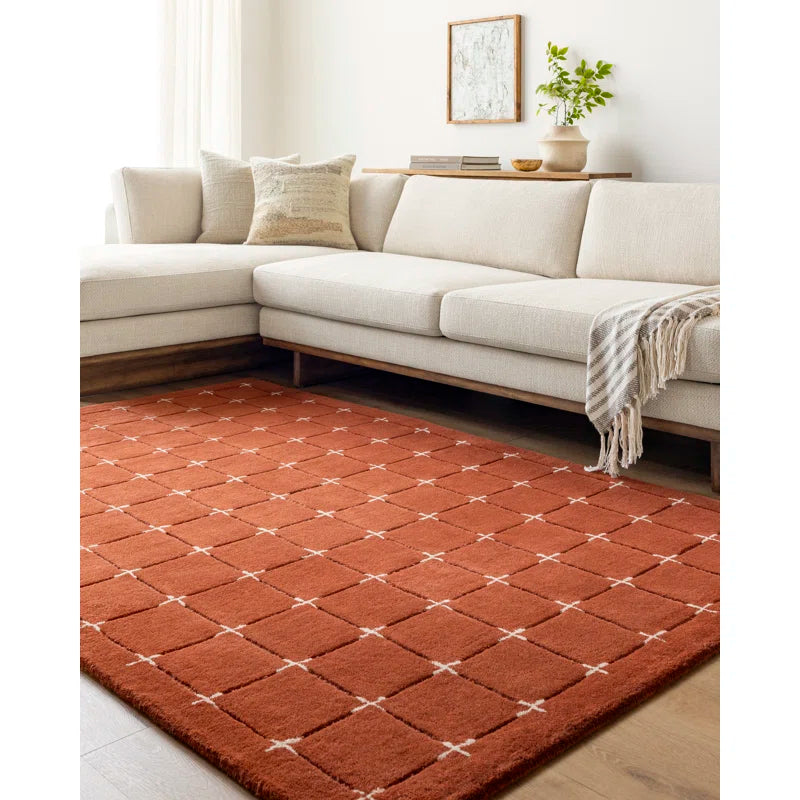 Stitchgrid hand tufted wool carpet in burnt brick red
