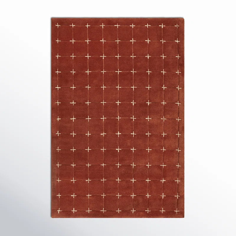 Stitchgrid hand tufted wool carpet in burnt brick red
