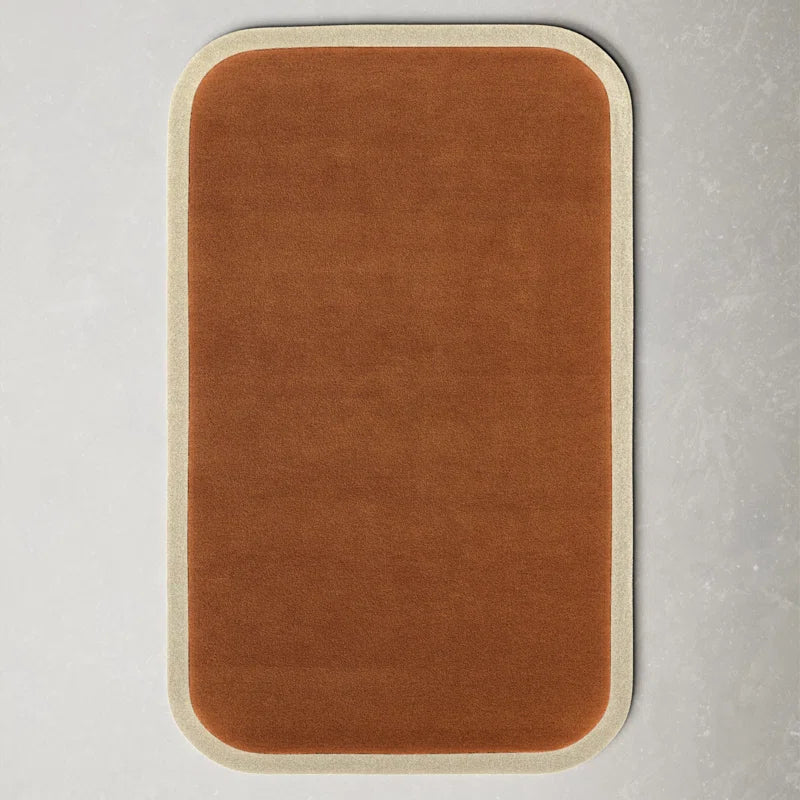 Clay Curve hand tufted wool carpet in caramel