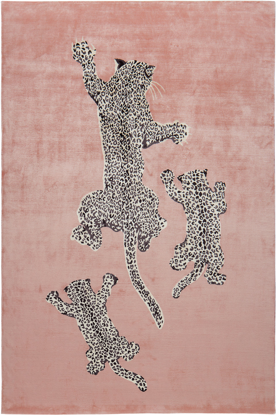 Pink rug with black and white leopard print designs