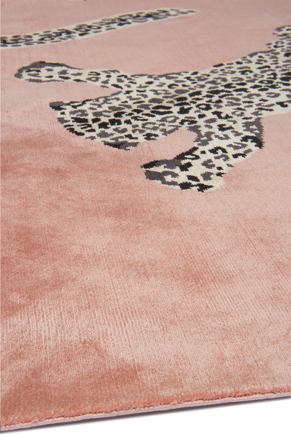 Pink rug with leopard print design