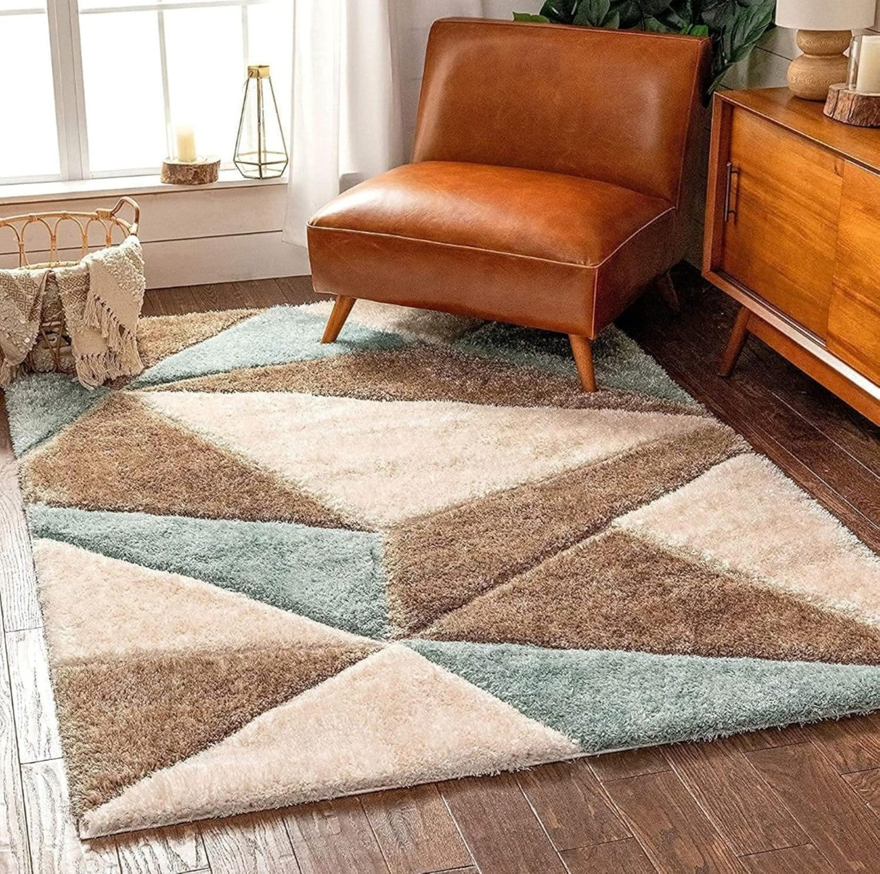 Geometric patterned rug with brown leather chair