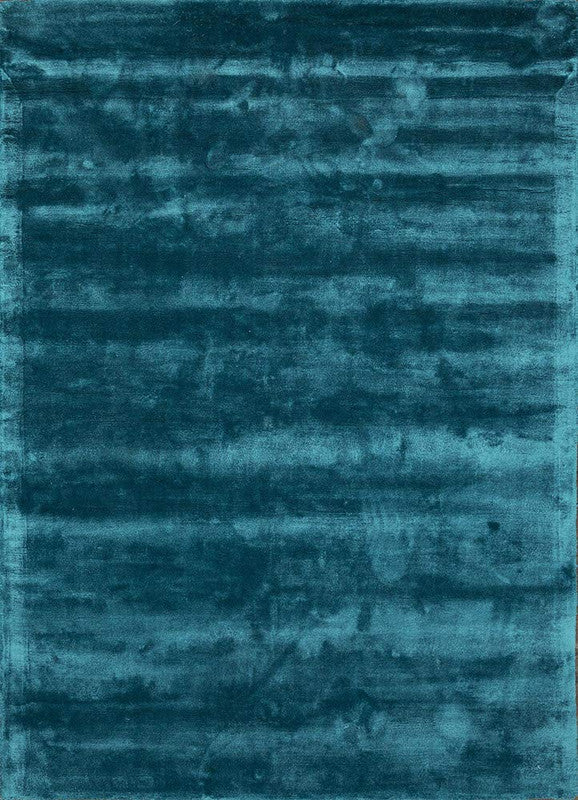 Teal rug with a textured pattern