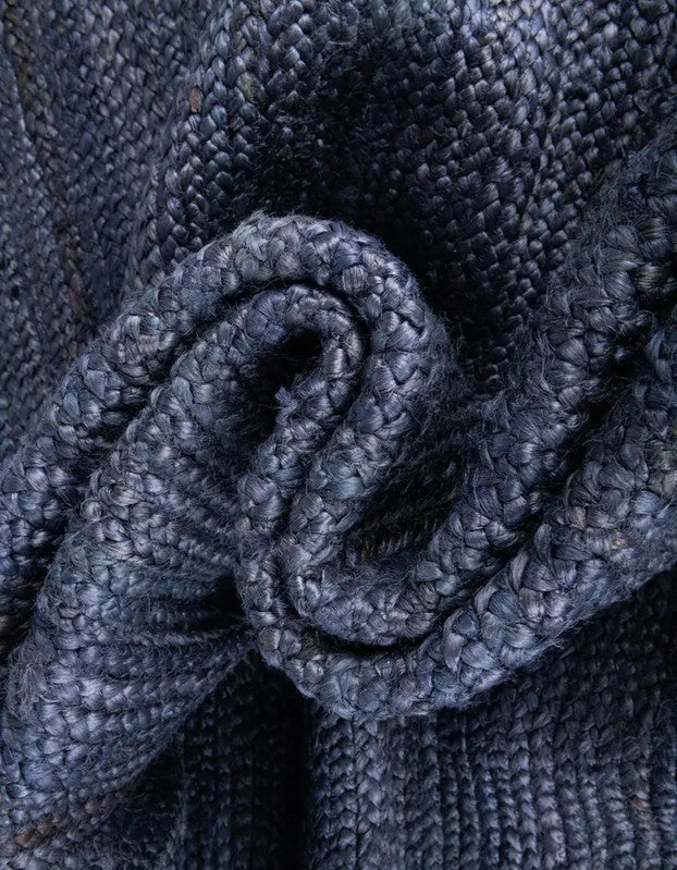 Close-up of textured blue fabric with a knot