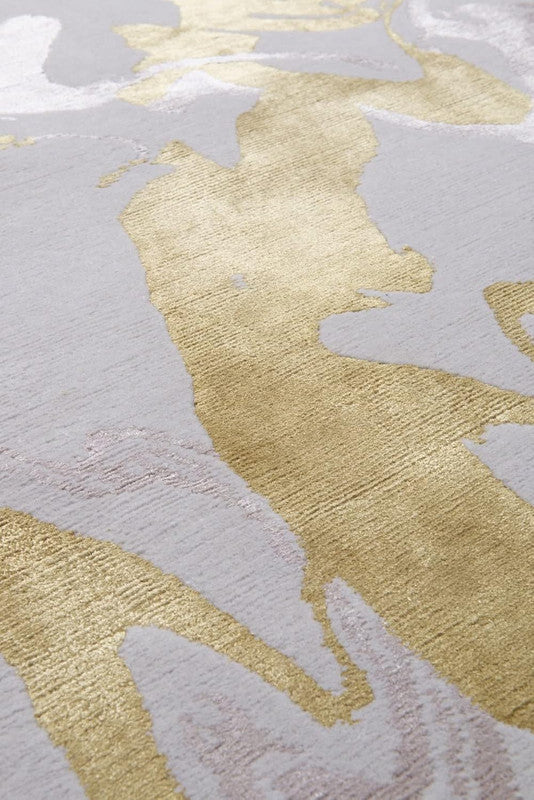 Close-up of a textured surface with gold and gray patterns