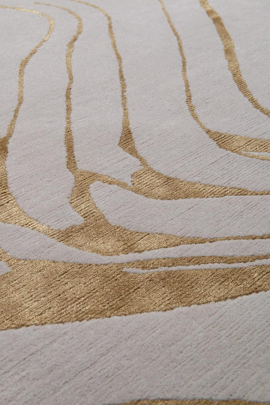 Close-up of a textured surface with gold and beige patterns