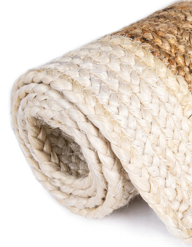 Rolled jute rug on a white background