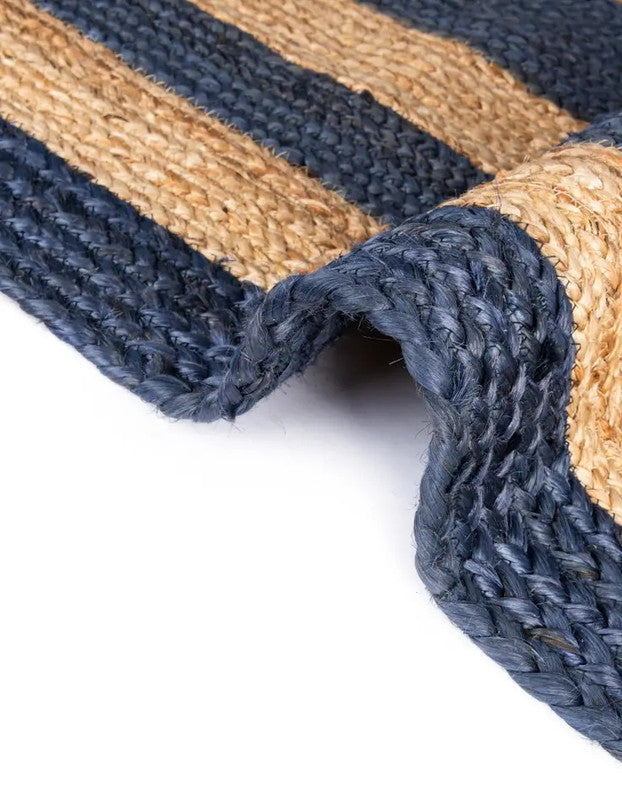 Close-up of a blue and beige woven mat on a white background