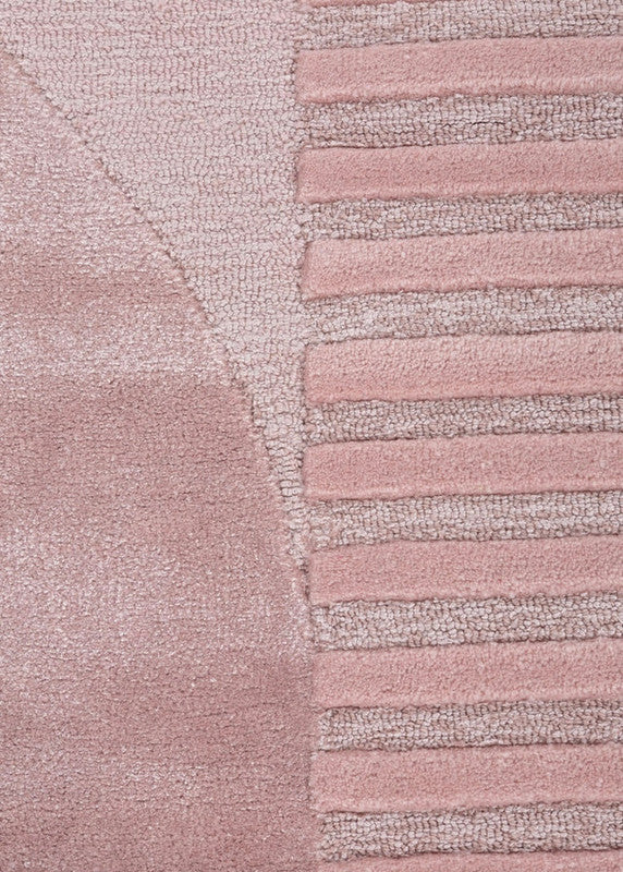 Close-up of a textured pink rug with a striped pattern