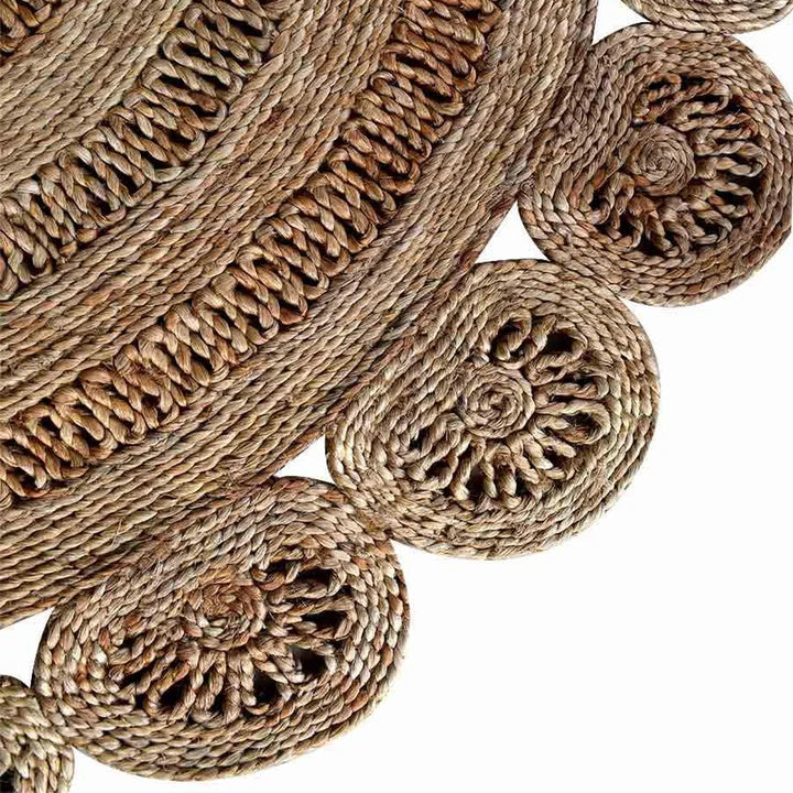 Close-up of woven jute coasters with intricate patterns on a white background