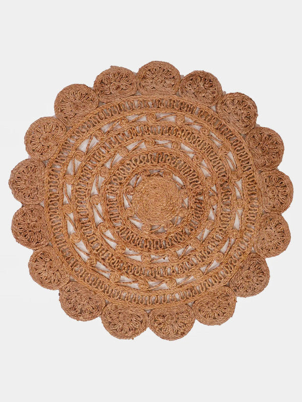Round woven placemat with a scalloped edge on a white background