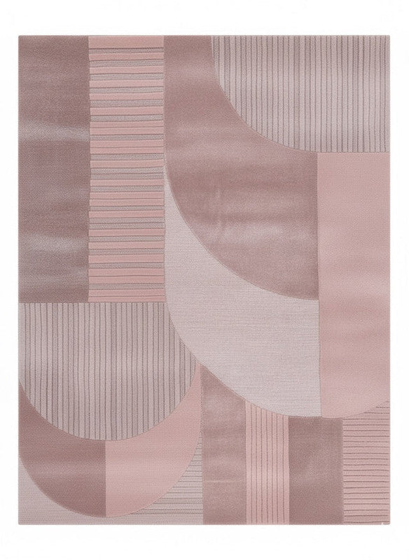 Geometric patterned rug with shades of pink and gray on a white background