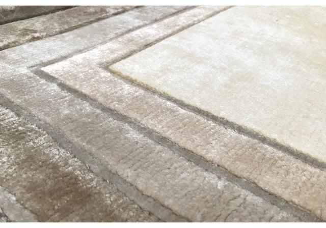 Textured area rug with a pattern of diagonal stripes in neutral colors.